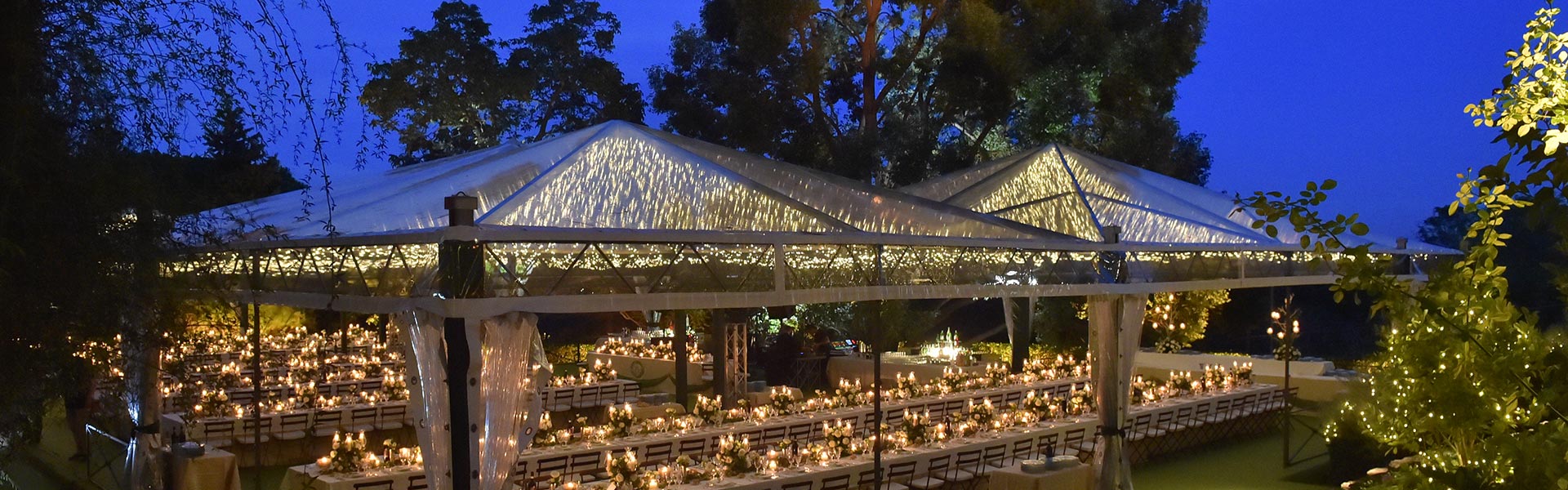 Crystal marquees for evening outdoor wedding in the luxurious garden of a private villa along the via Appia Antica in Rome